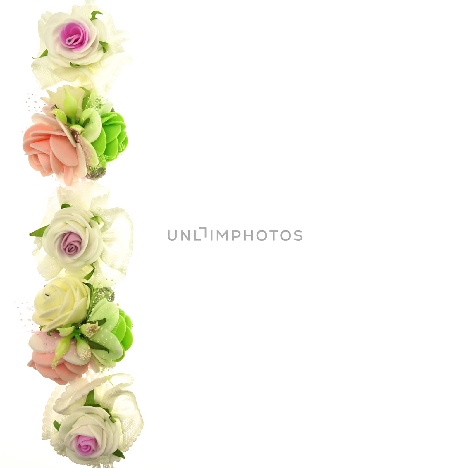 Vintage white and pink fabric flower on left isolated with white background.