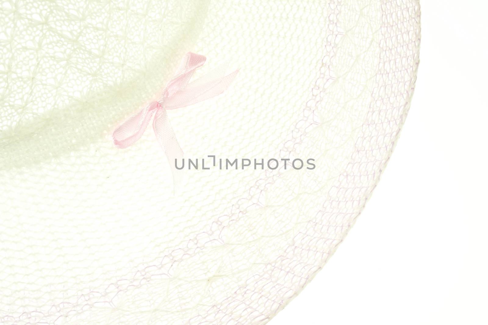 White and purple Weave hat with pink bow for woman isolated on white background.