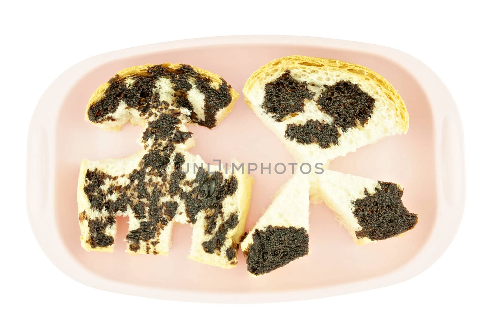 Bread pour with chocolate as rocket and alien place on pink tray isolated on white background.