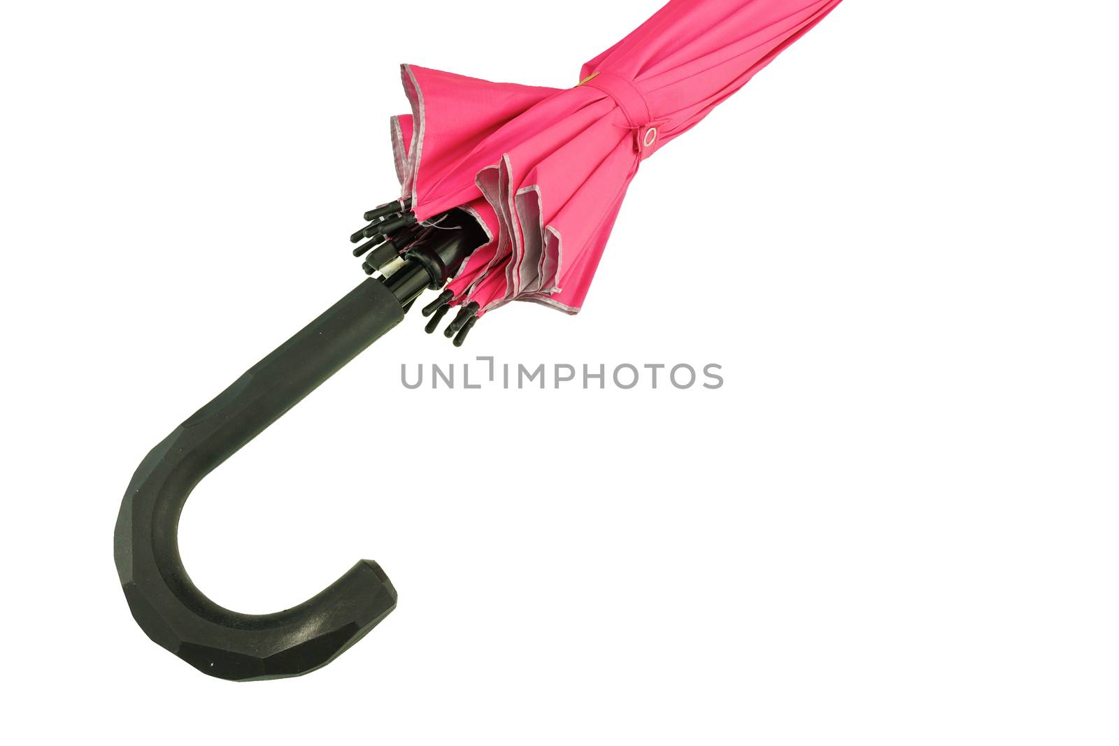 Black handle of pink umbrella closed isolated on white background.