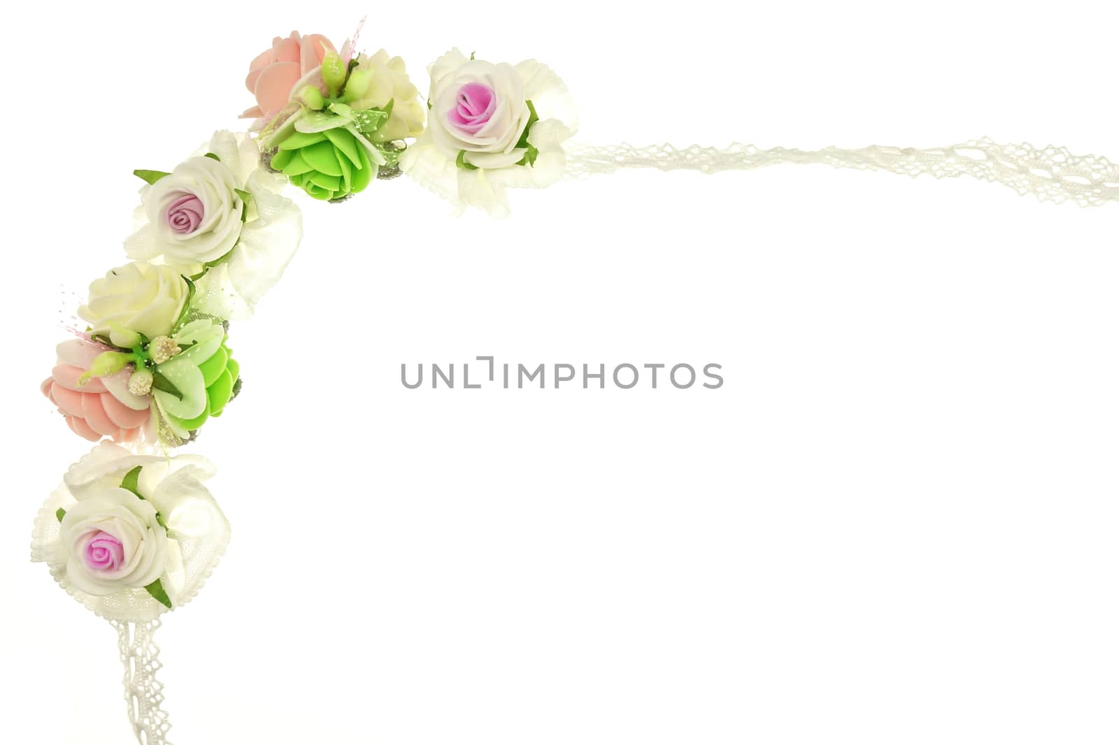 Vintage white and pink fabric flower isolated with white background.