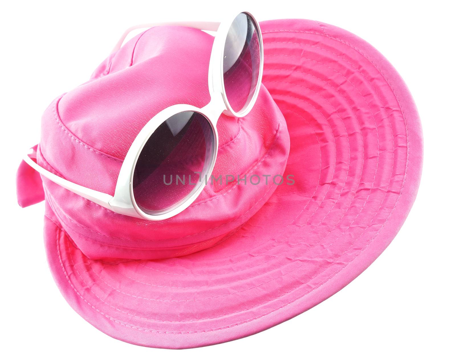 White sun glasses put on pink hat isolated by eaglesky