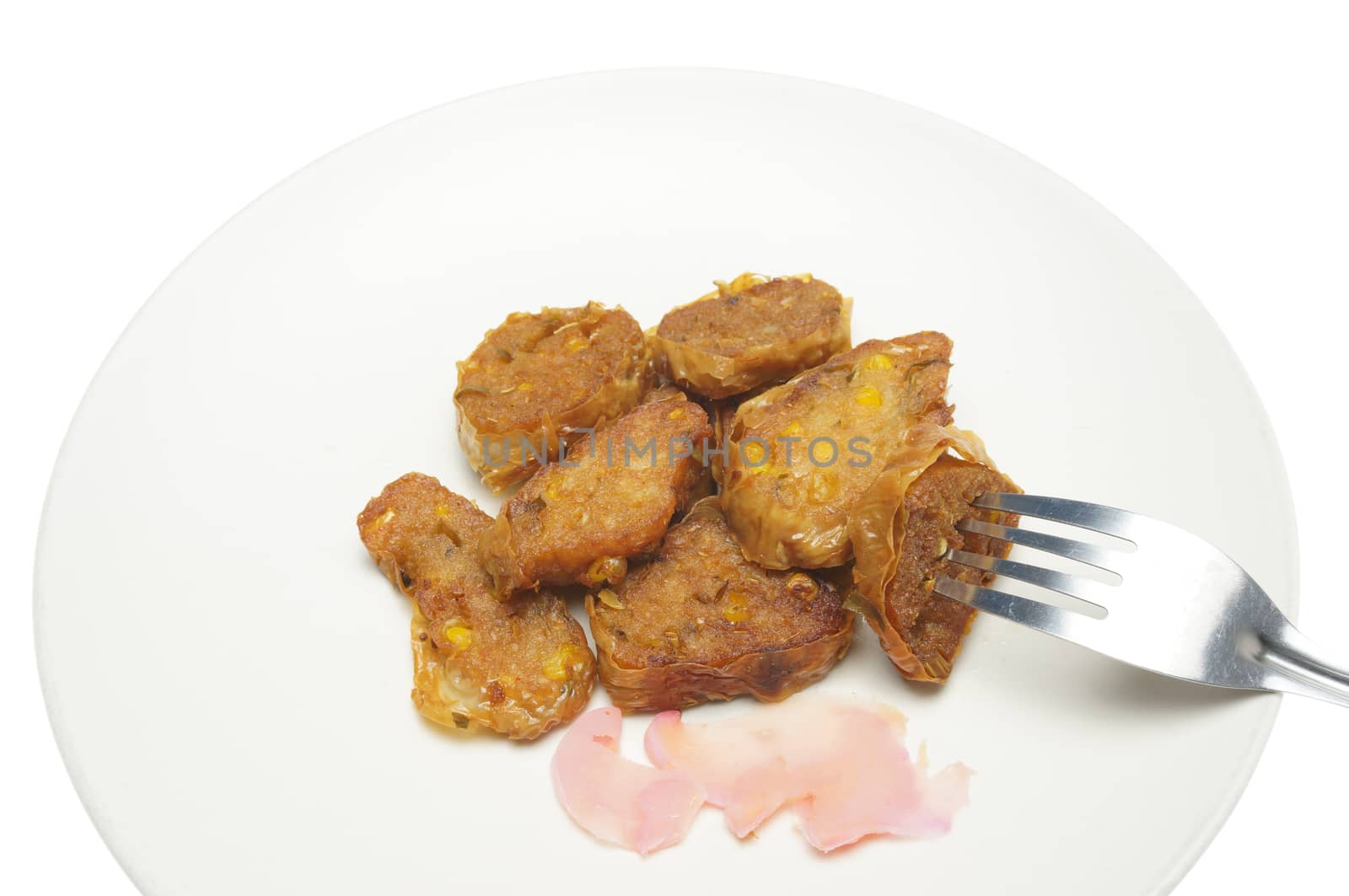 Eating deep fried roll vegetarian with ginger pickled and fork on dish isolated with white background.