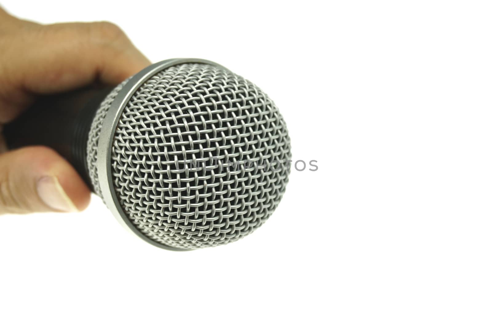 Hand hold black and silver microphone isolated with white background.