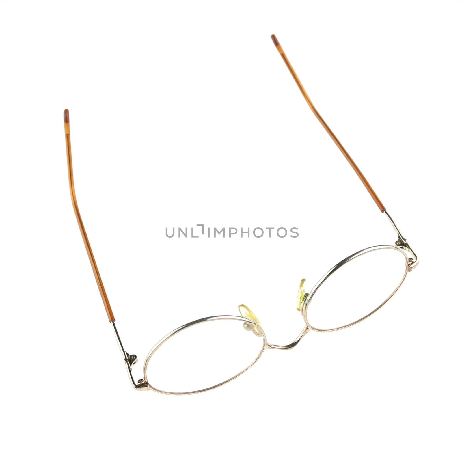 Old glasses for problem vision put upturned isolated by eaglesky