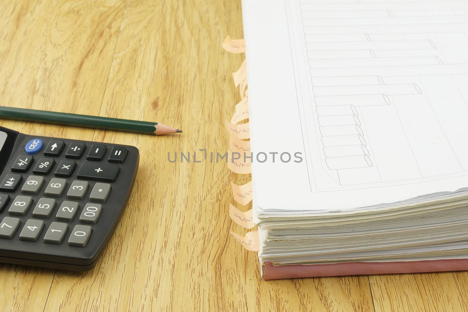 Index document include sales and receipt place with calculator and pencil on wood background.