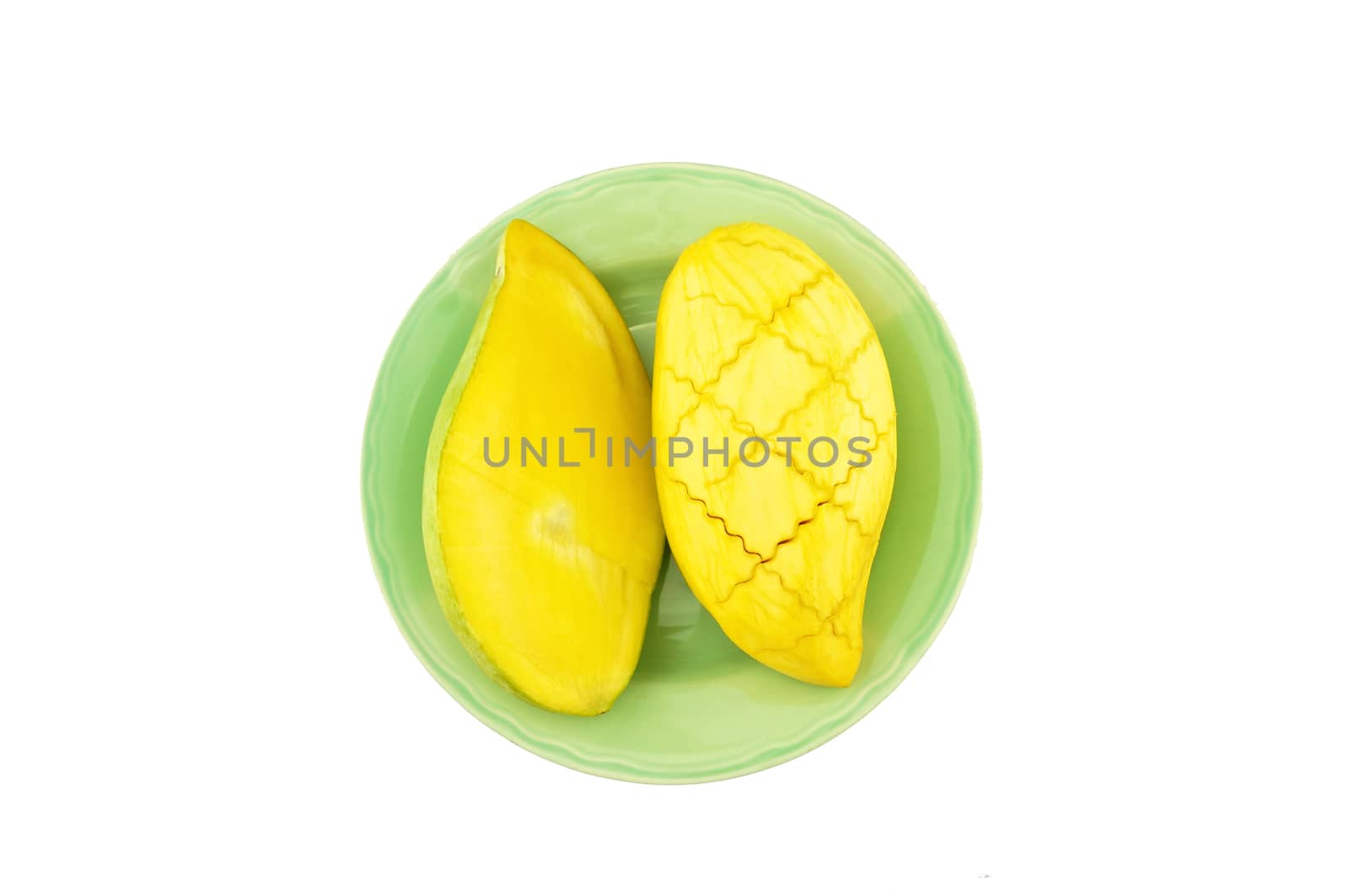 Slice half ripe mango on dish isolated with white background.