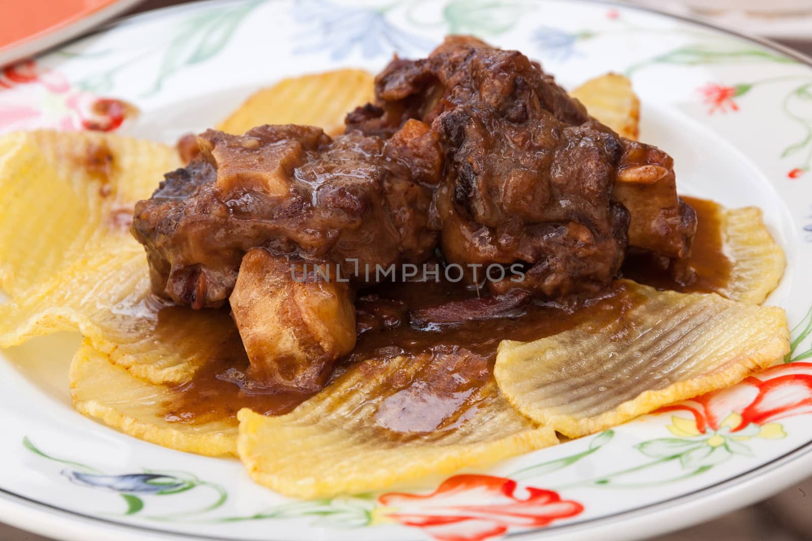 Bull tail stew with fried potatoes.  by serpl