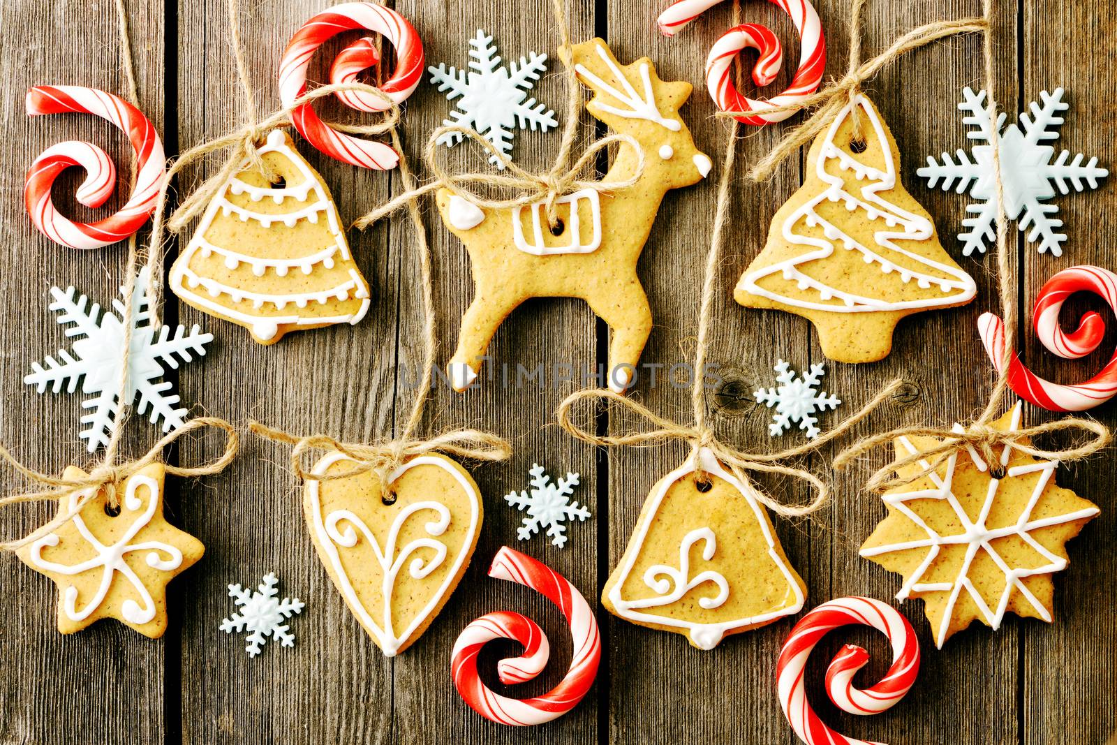 Christmas homemade gingerbread cookies over wooden table