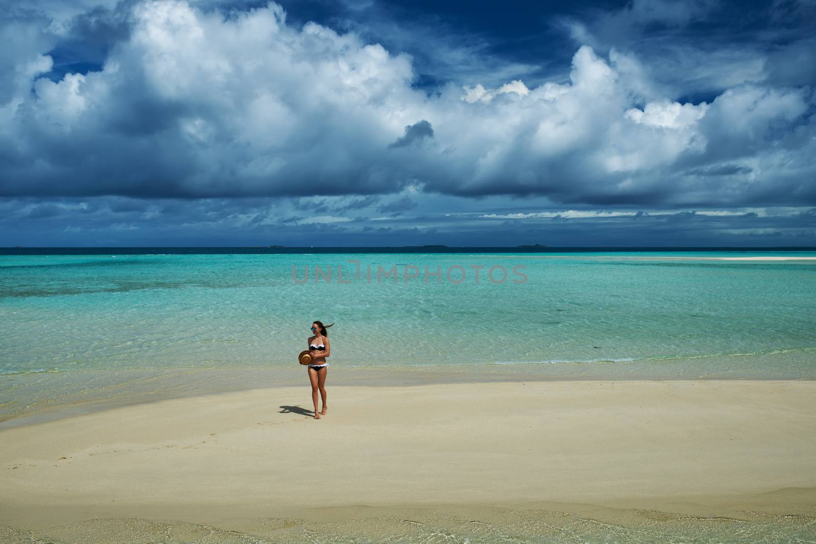 Woman in bikini at tropical beach