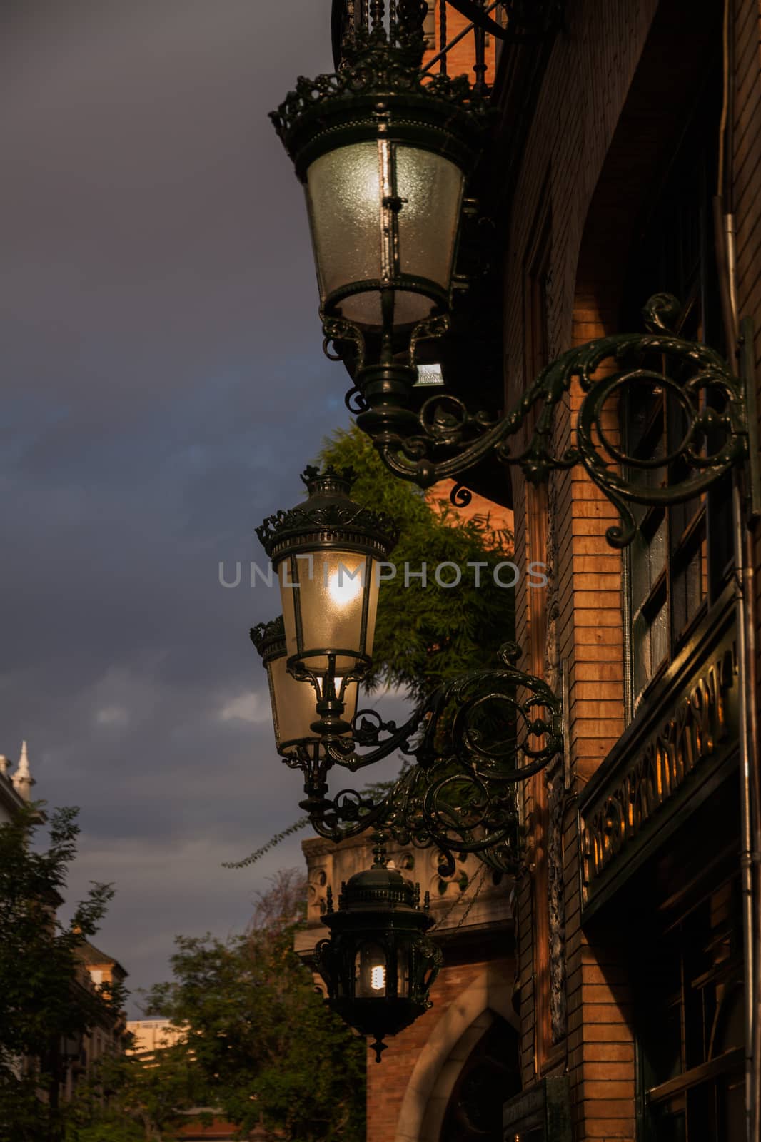 Glowing street lamp at night, Sevilla, Spain