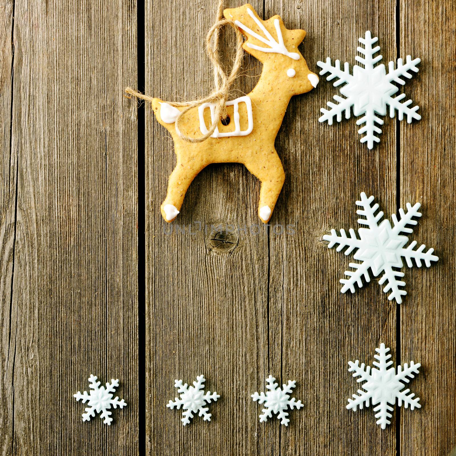 Christmas homemade gingerbread cookies over wooden table