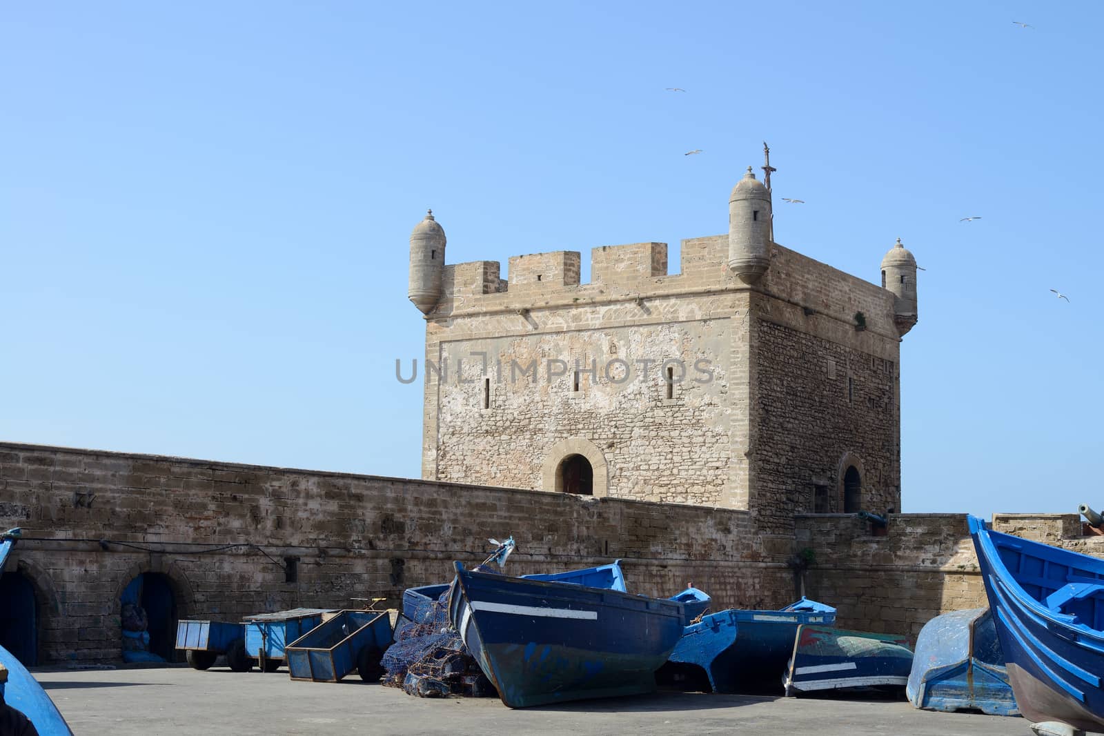 Blue fishing boats and fortress at Essaouira in Morocco