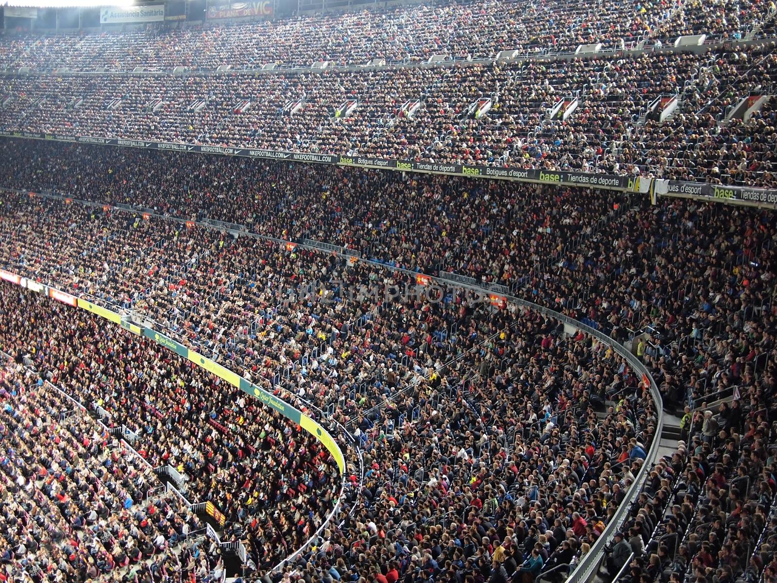 Barcelona, Spain – October 22, 2011: Spectators in a sold out Barcelona football stadium Camp Nou during the match between FC Barcelona and FC Sevilla on October 22, 2011.