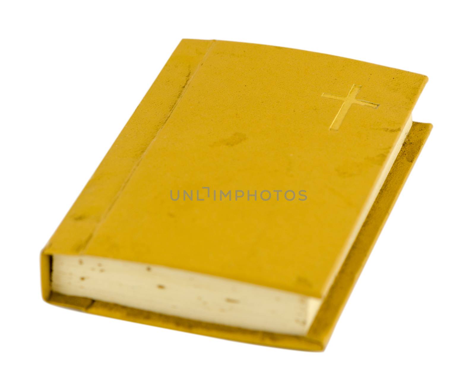 old small prayer book with yellow hard cover isolated on white background