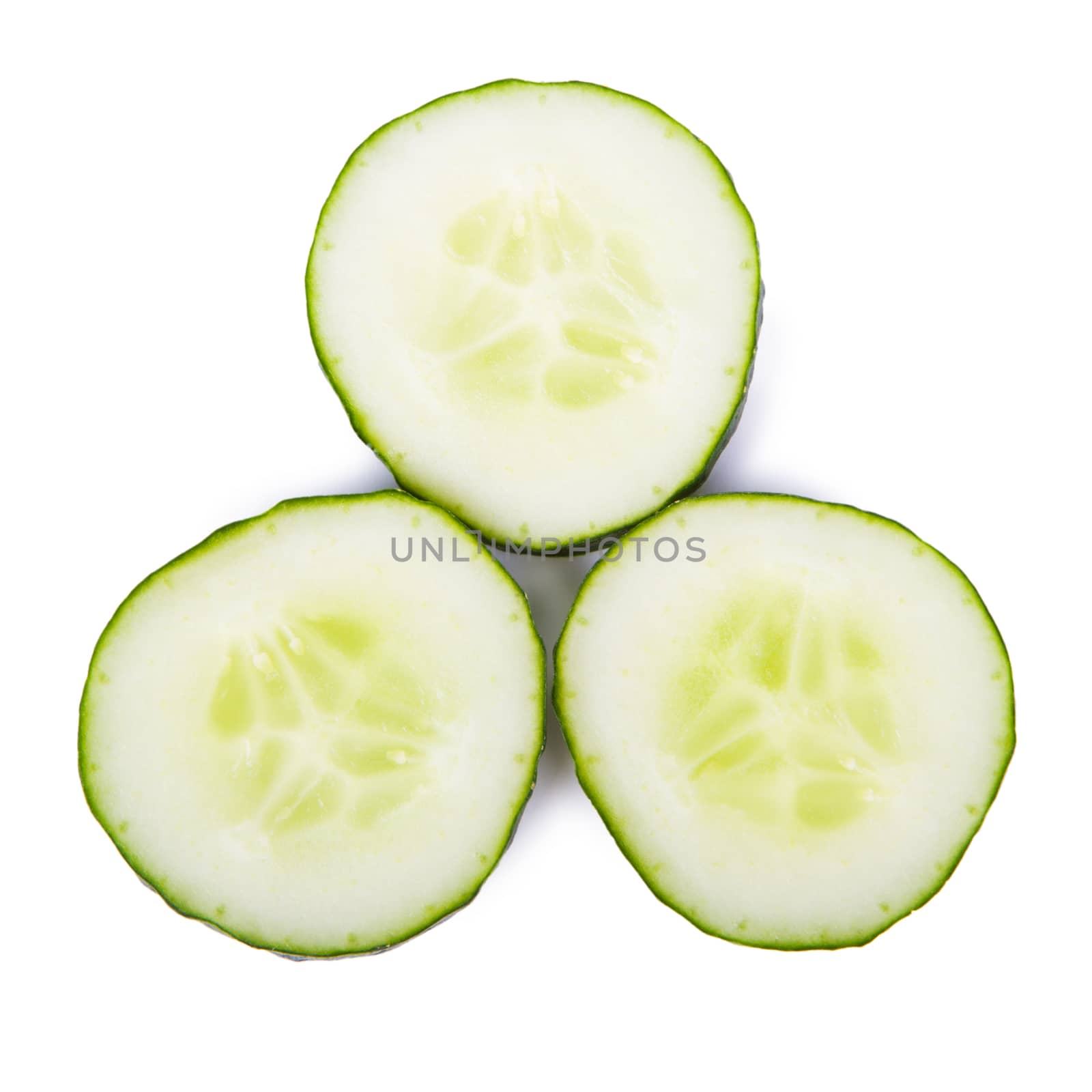 Sliced cucumber isolated on white - Stock Image