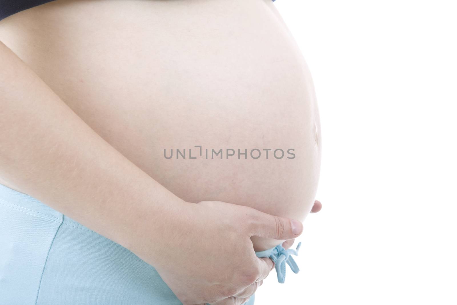 Closeup of pregnant woman at white background