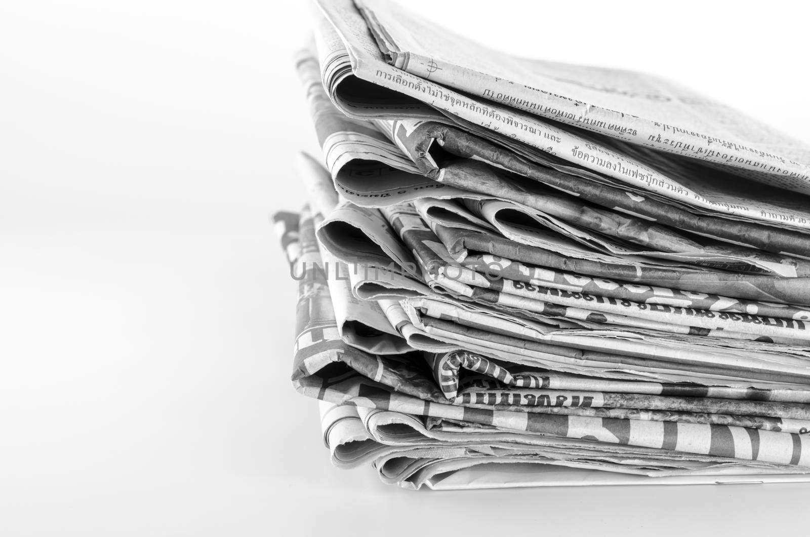 black and white stack of newspaper