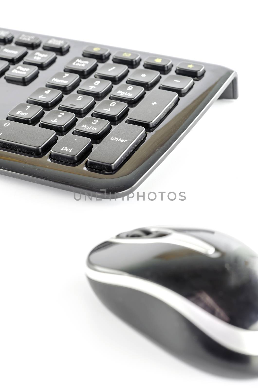 keyboard and wireless mouse on a white background
