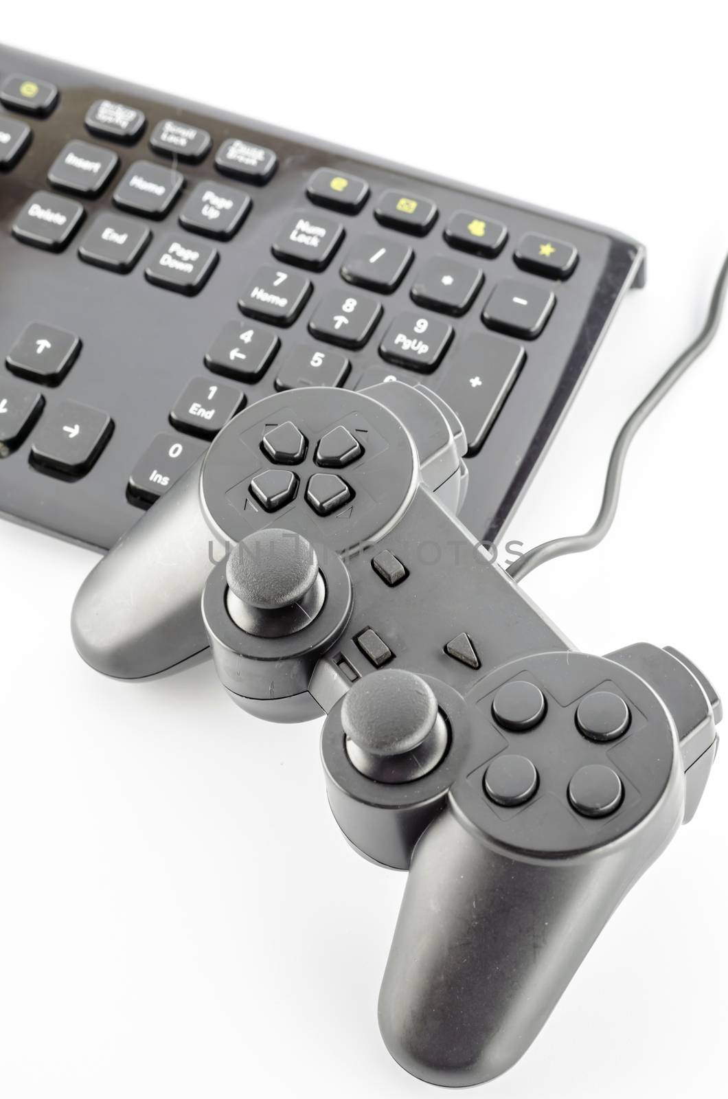 keyboard computer and game controller on a white background