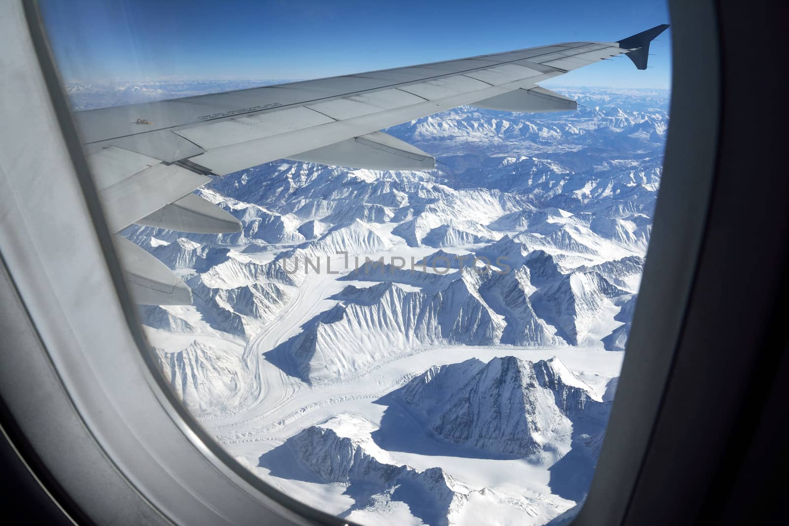 Mountain range view from aircraft window, Leh, Ladakh, India by think4photop