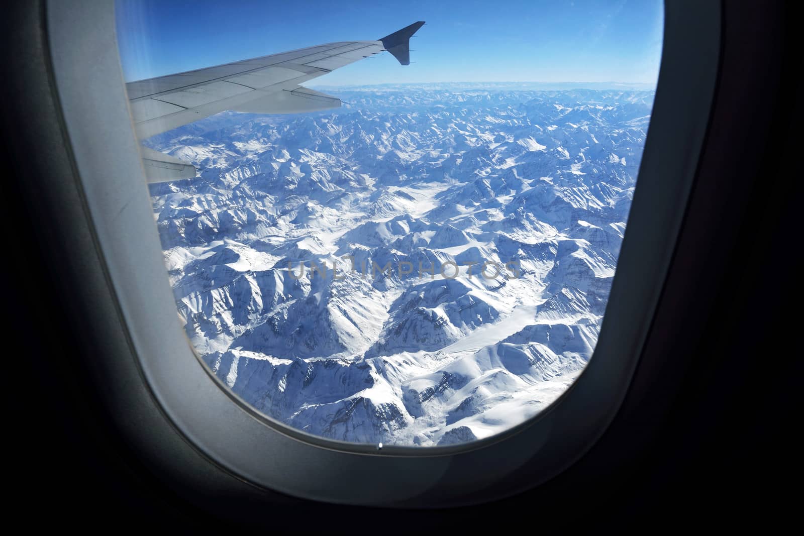 Mountain range view from aircraft window, Leh, Ladakh, India by think4photop