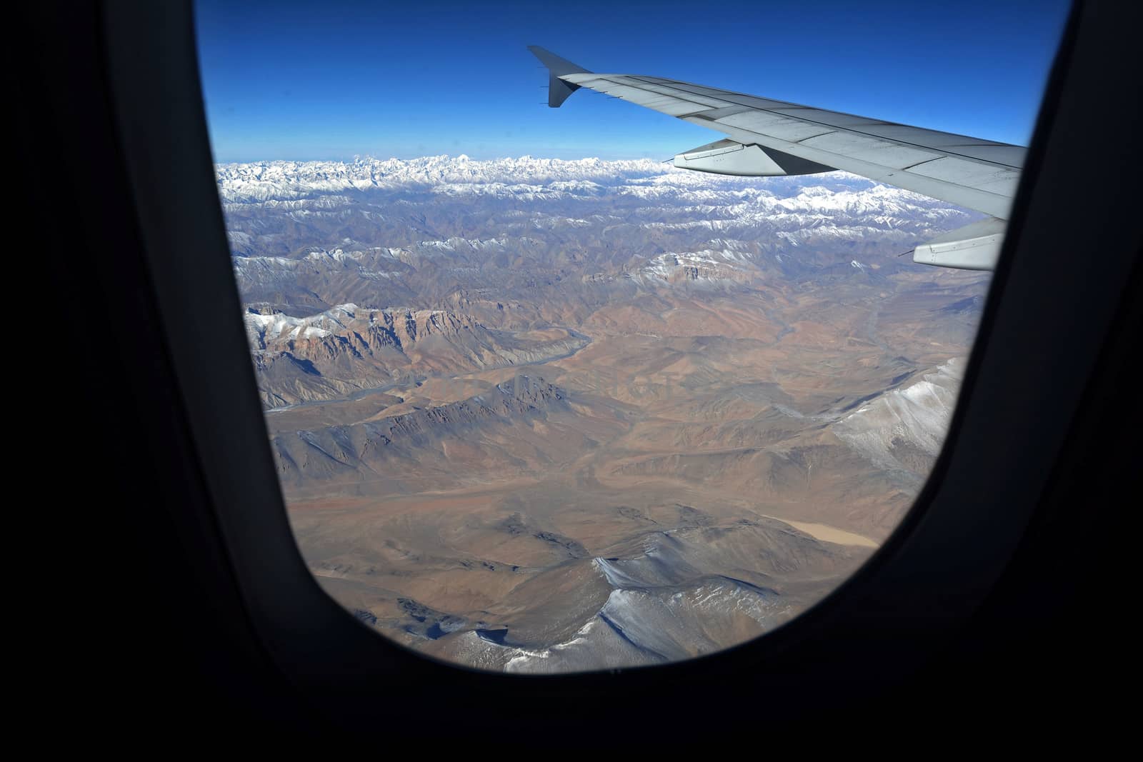 Mountain range view from aircraft window, Leh, Ladakh, India by think4photop