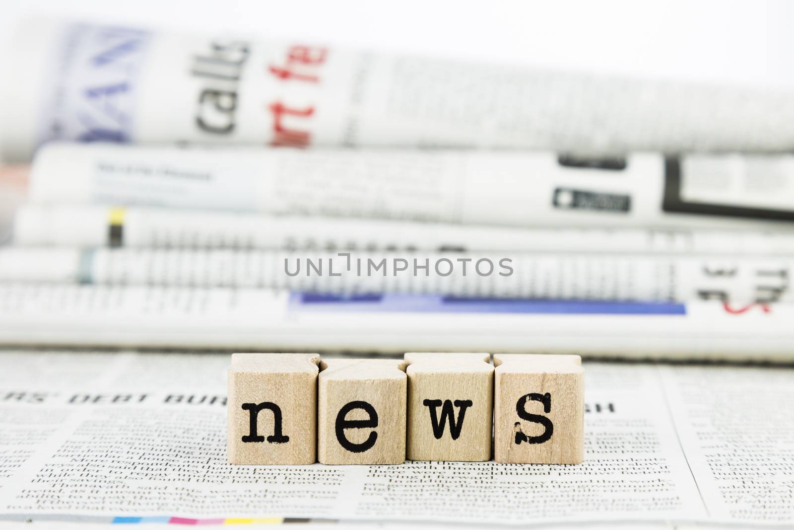 news concept, close-up wooden text wording on newspaper