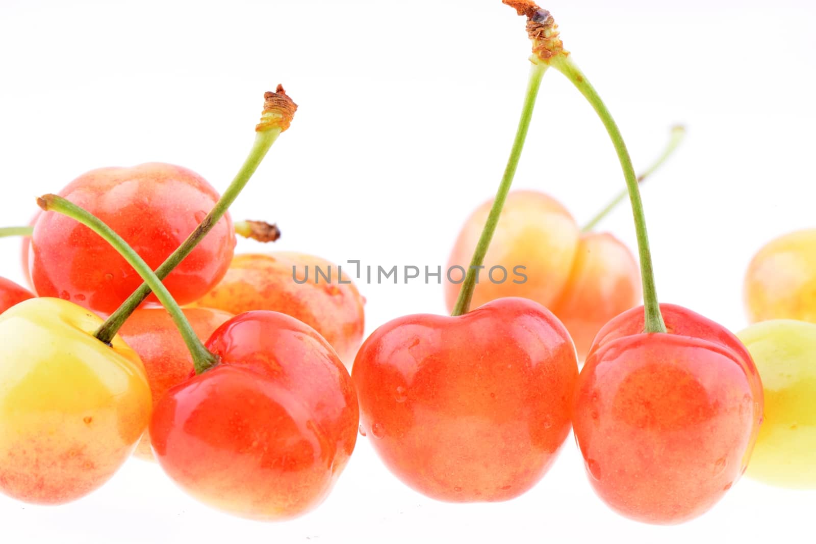 Many sweet cherries isolated on a white background