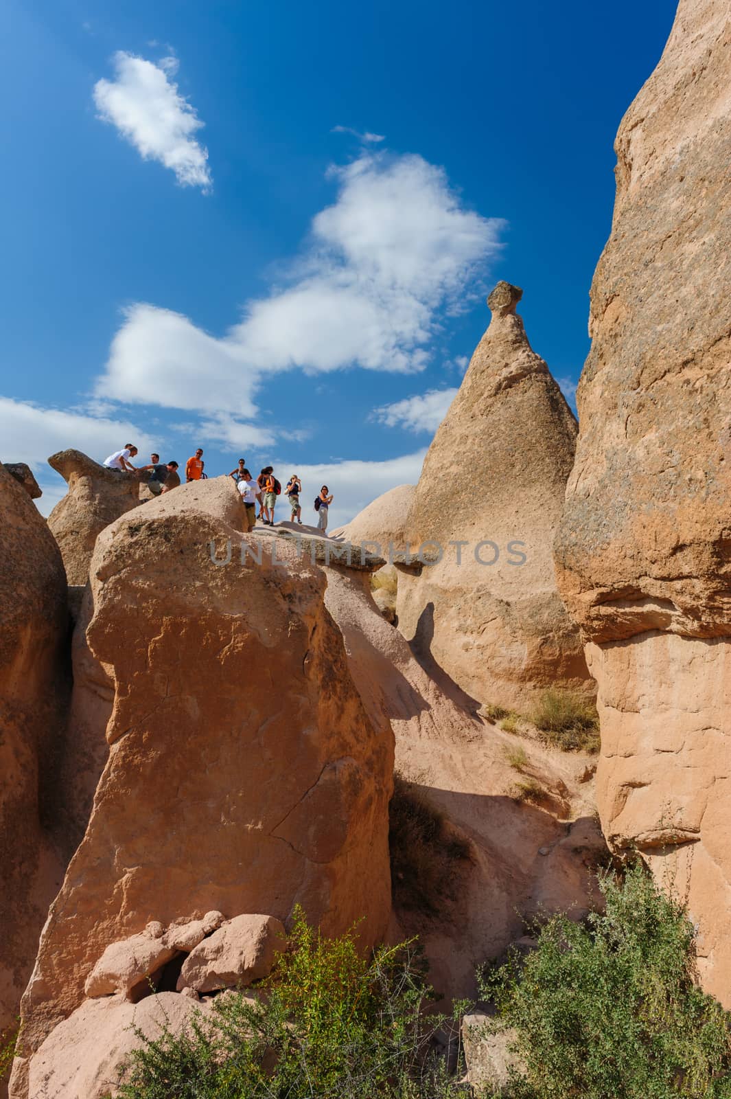 Tourists in rocks in Cappadocia, Turkey  by starush