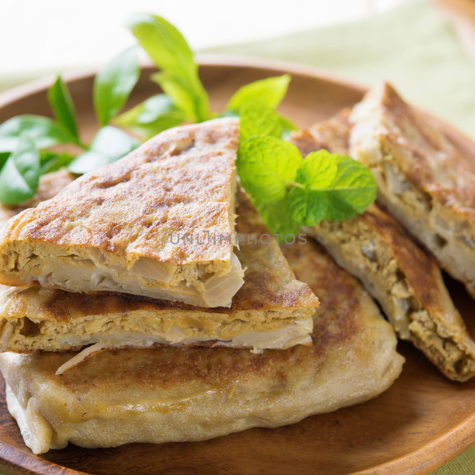 Stuffed pancake or pan-fried bread, martabak or murtabak, also mutabbaq