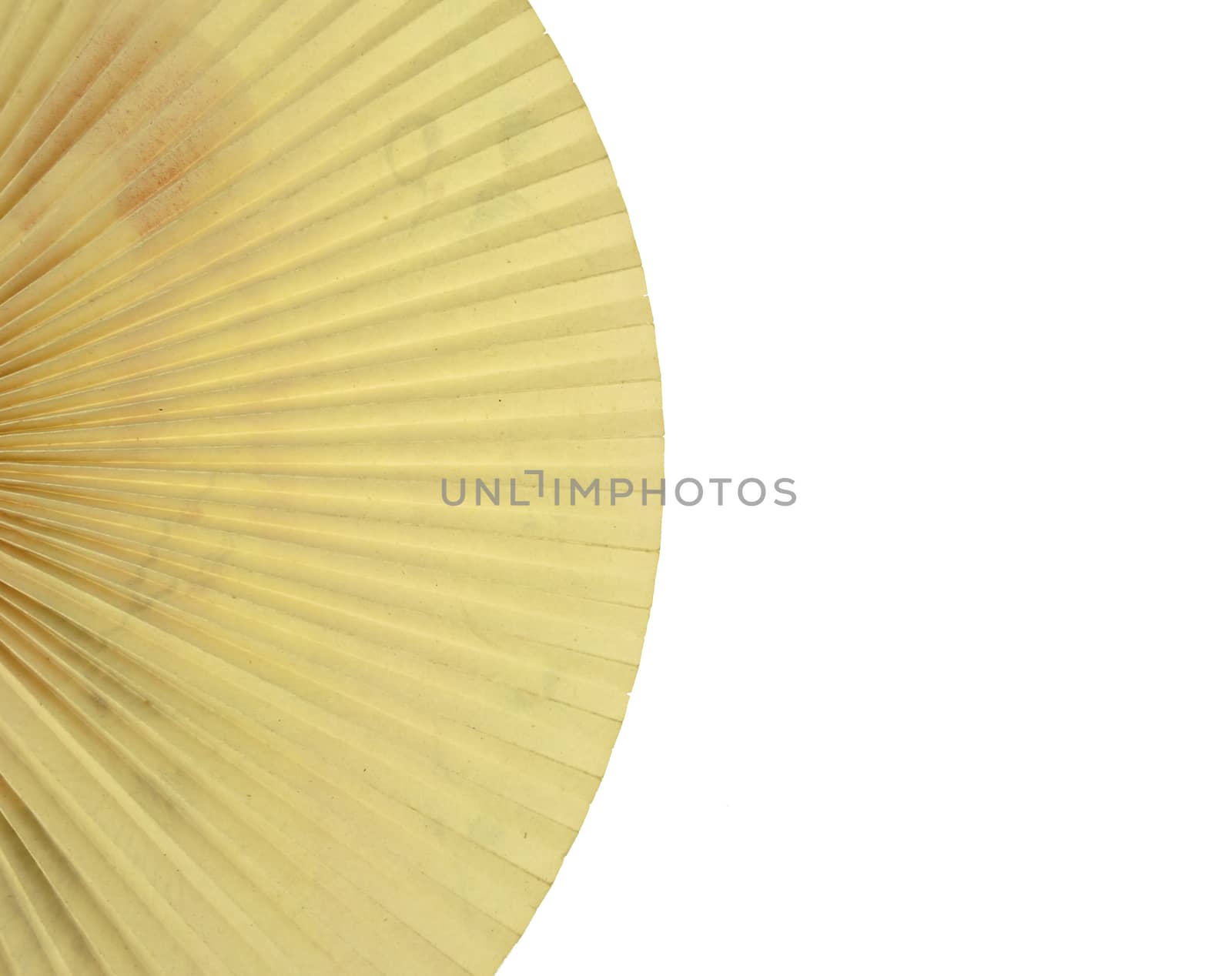 Vintage folding paper fan on left isolated with white background.