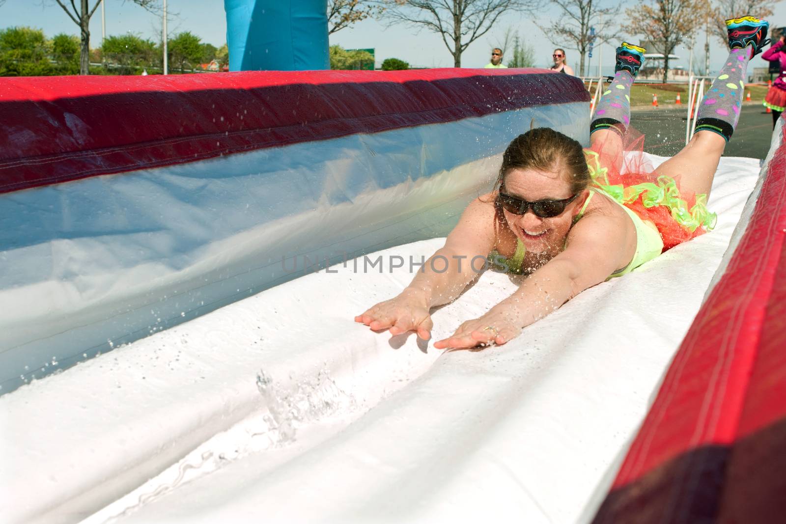 Woman Dives Onto Wet Slide At Crazy Obstacle Race by BluIz60