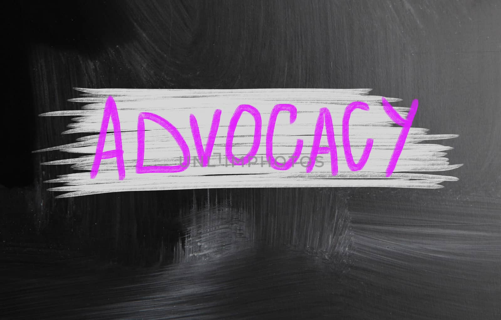 advocacy handwritten with chalk on a blackboard