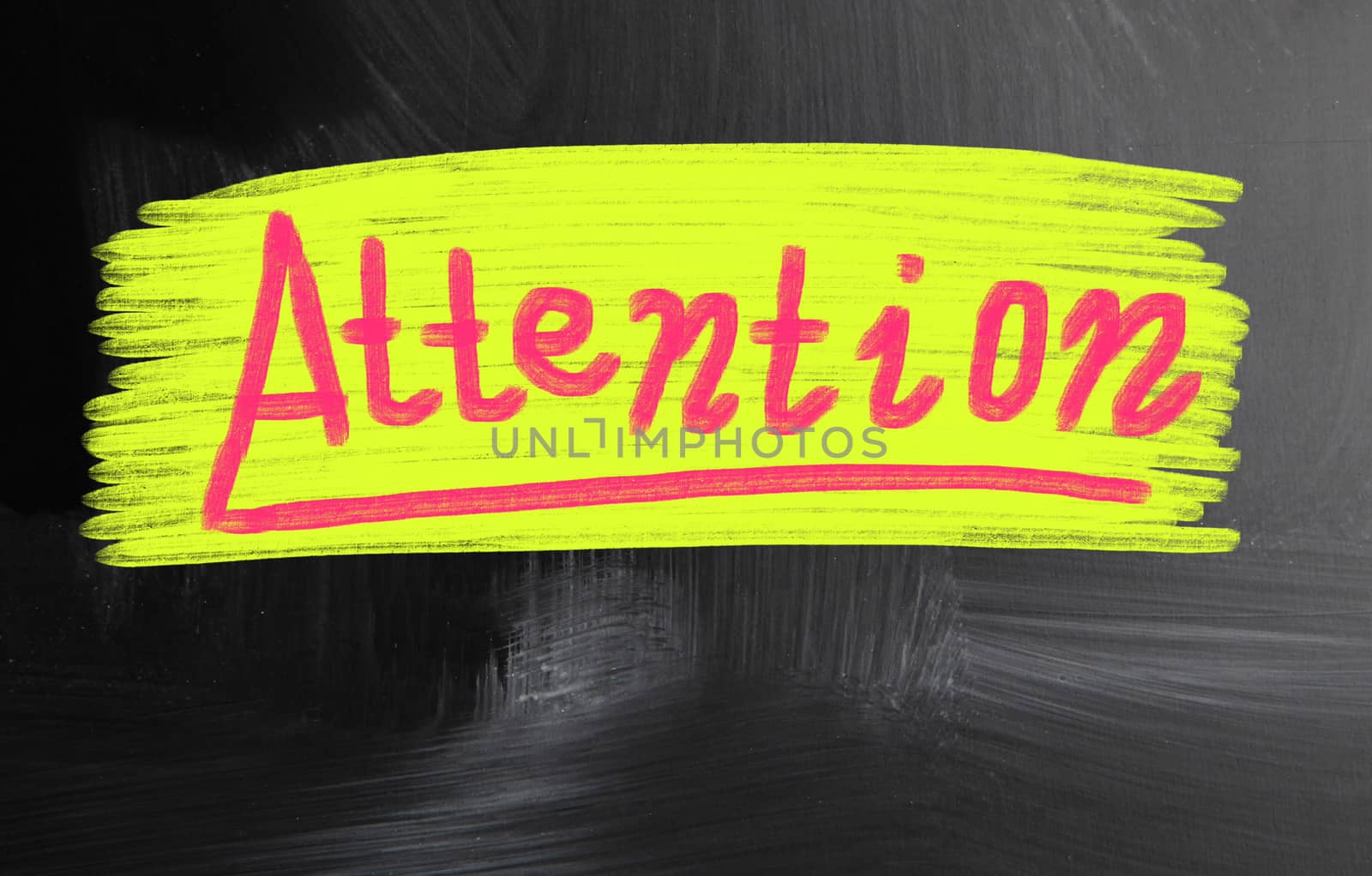 attention handwritten with chalk on a blackboard