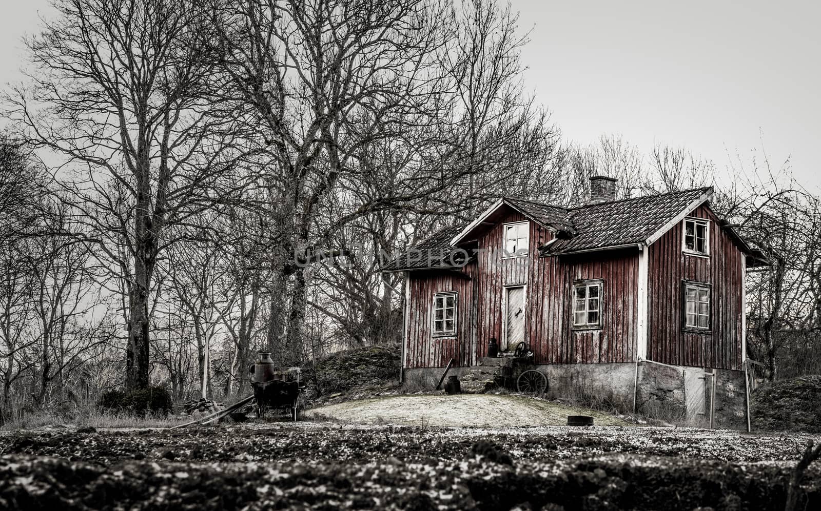 Old run down, ramshackle farm house in muted tones