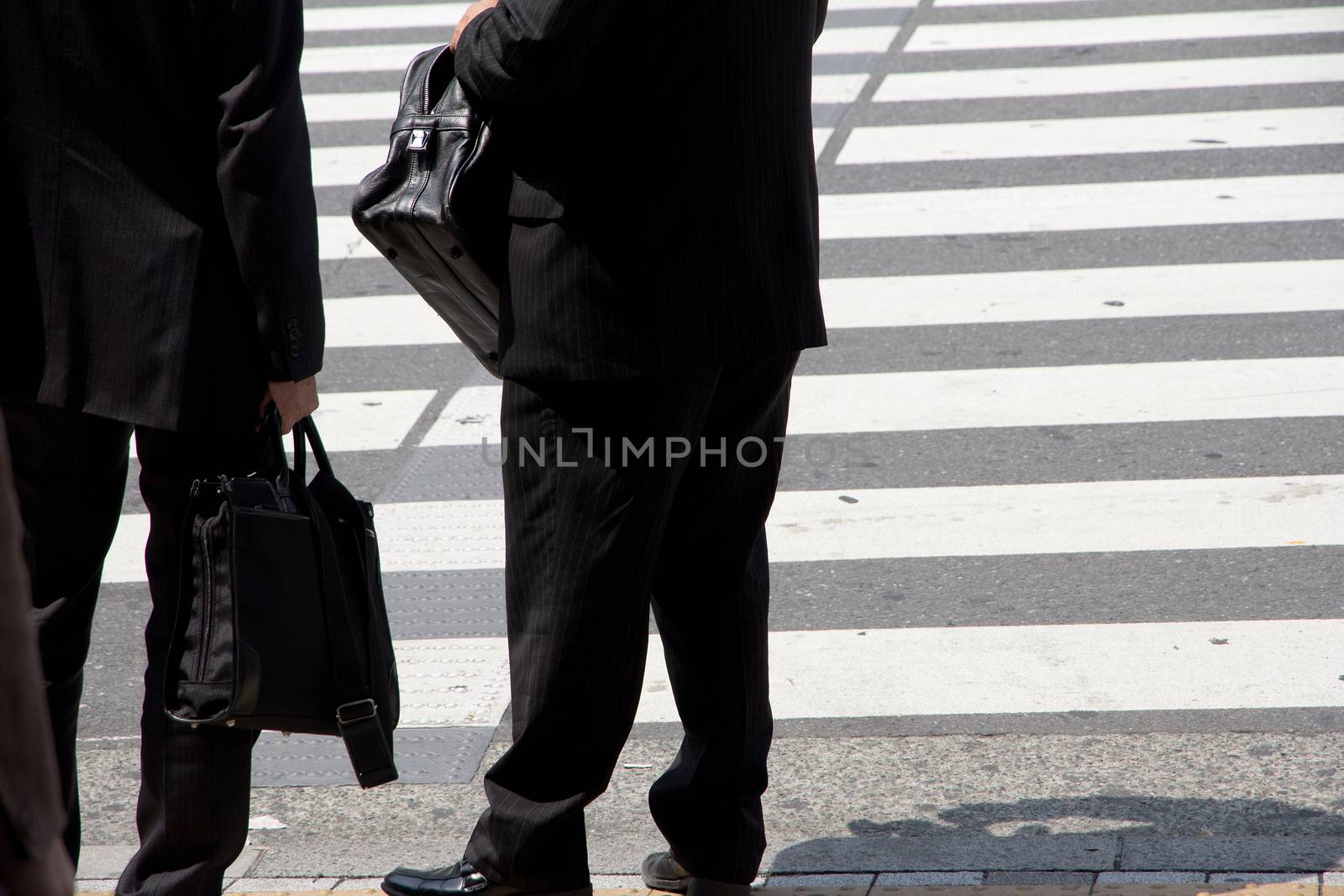 Business man waiting to cross the street,Tokyo Japan