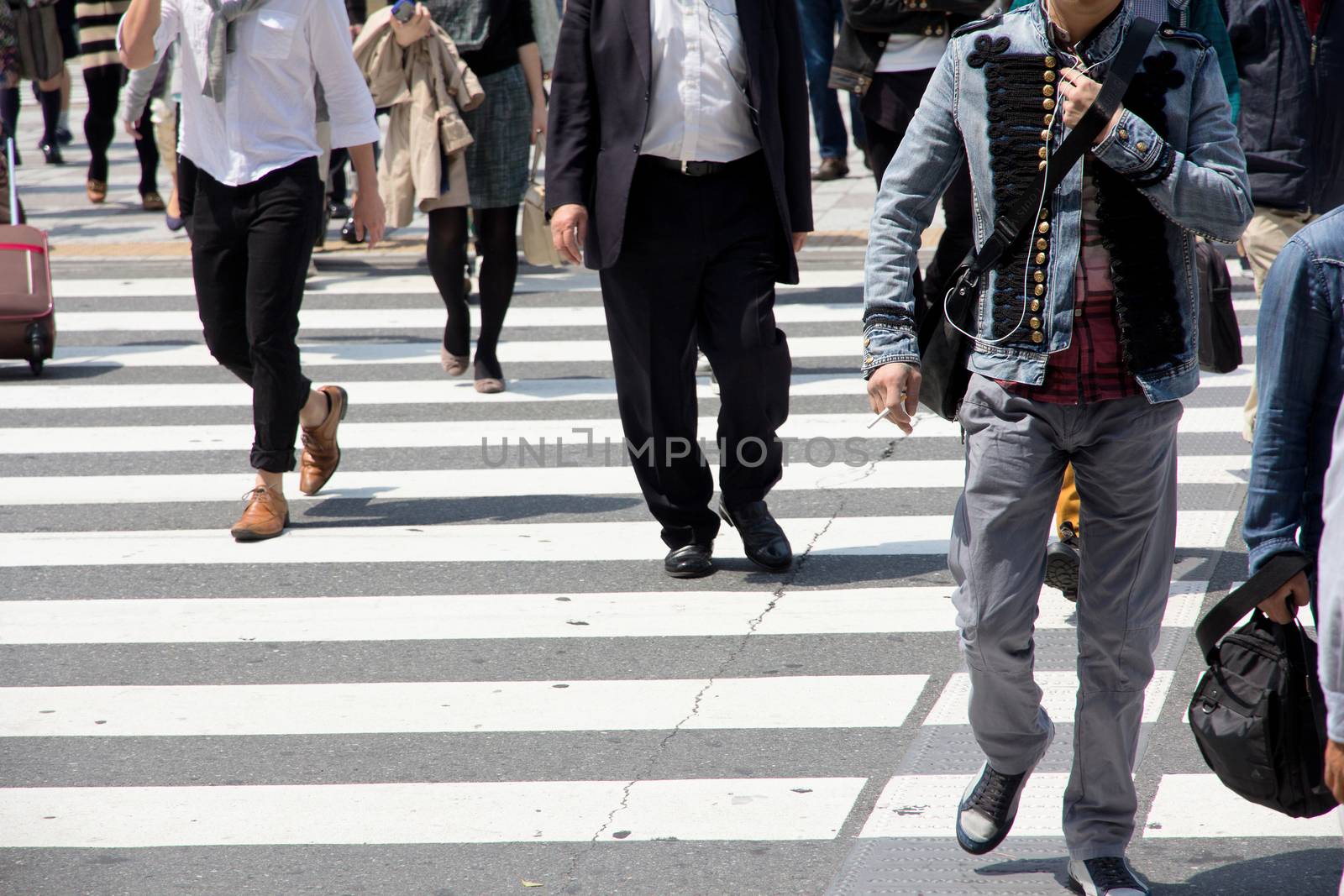 Crowds of businessman crossing the street