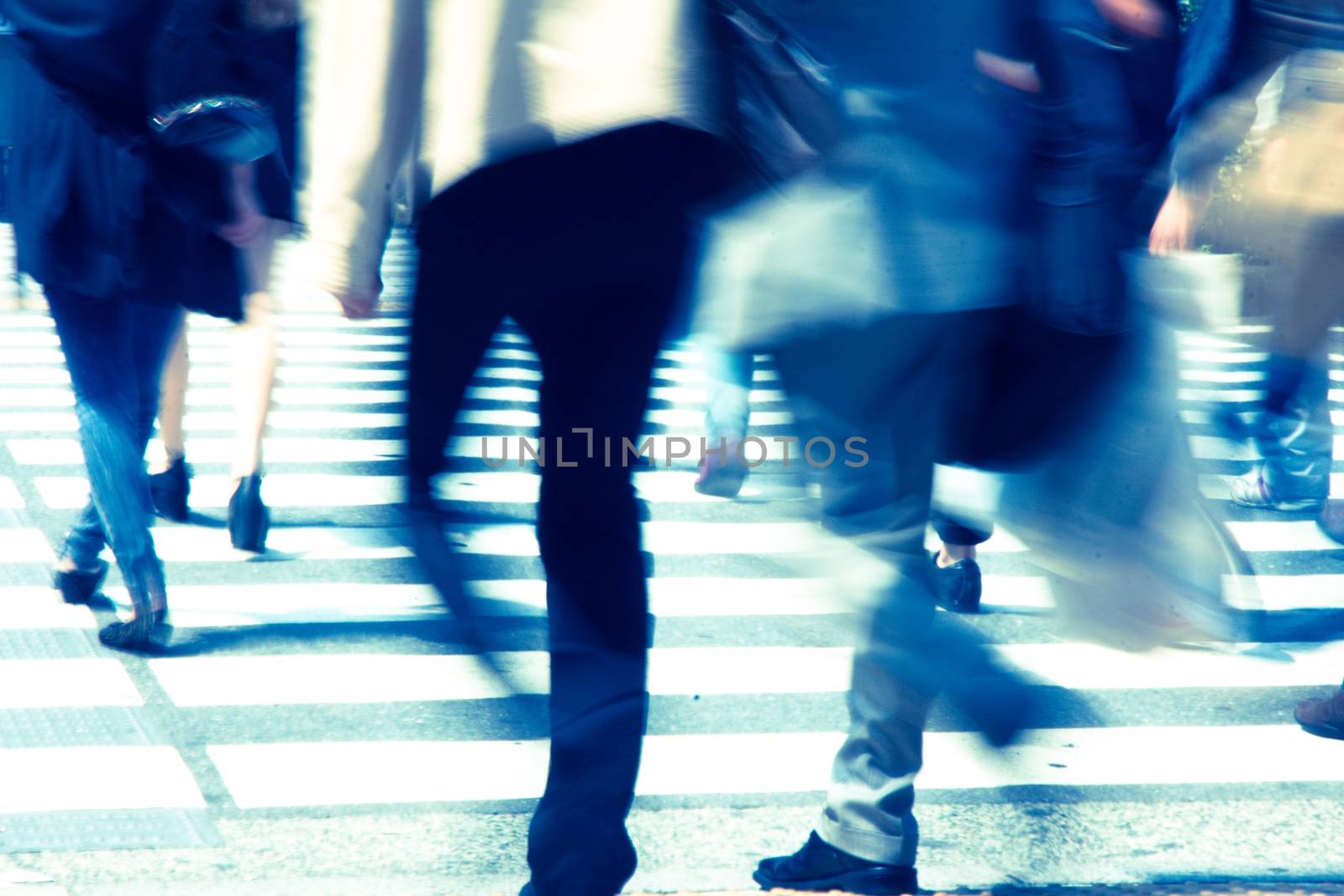 Crowds of pedestrians crossing the street