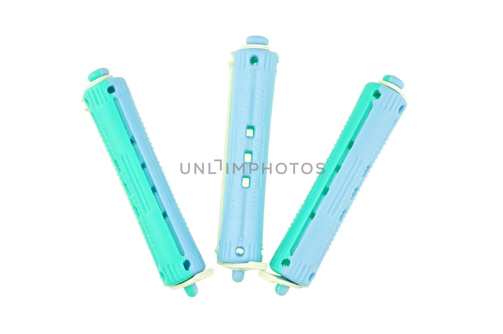 Blue plastic curler put as fork isolated with white background.