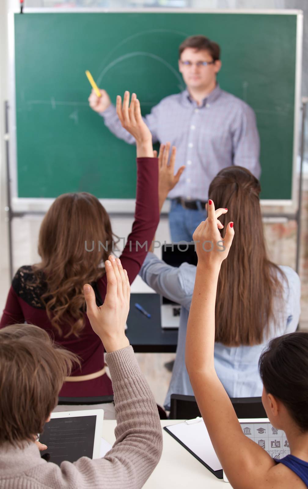 colledge students in classroom at lesson