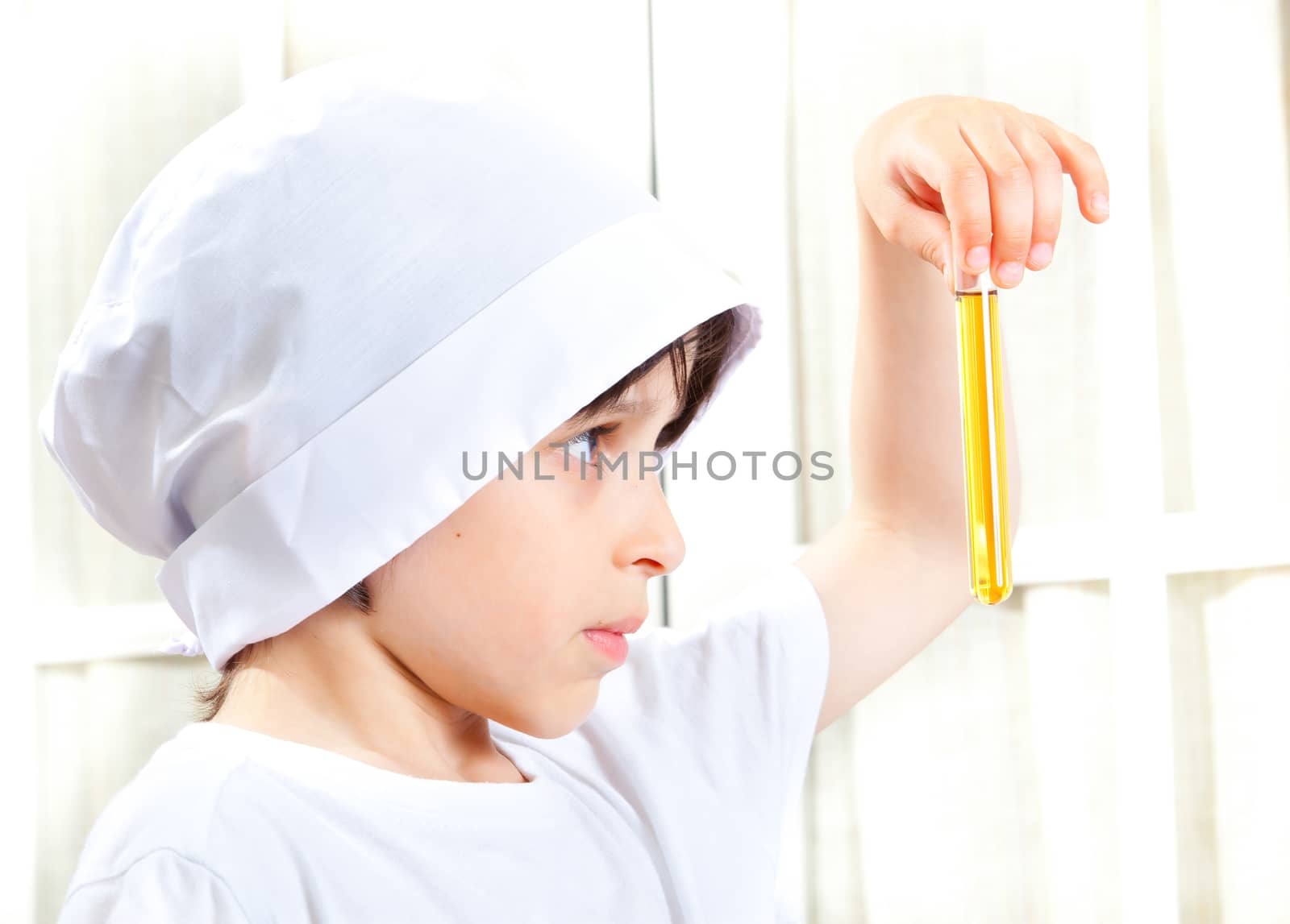 Little boy doing biochemistry research at the lab