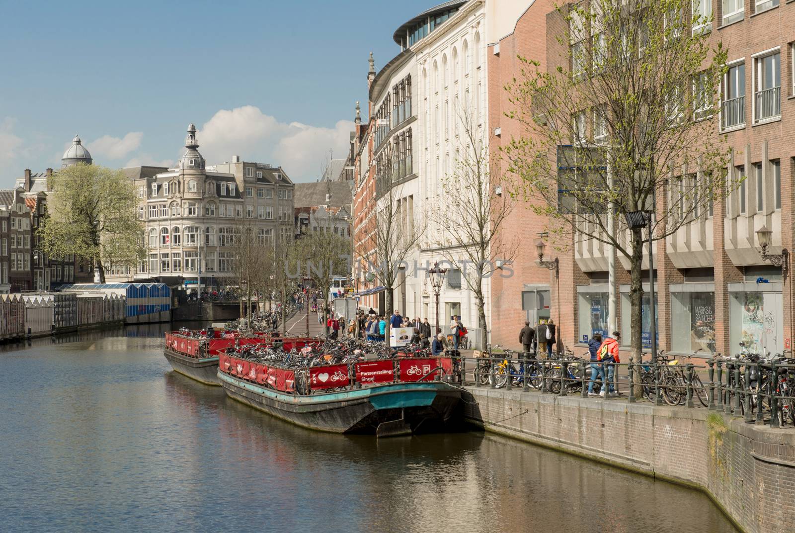 Amsterdam, The Netherlands - April 05, 2014; Amsterdam is the most watery city in the world. Canals and harbours fill a full quarter of her surface.
