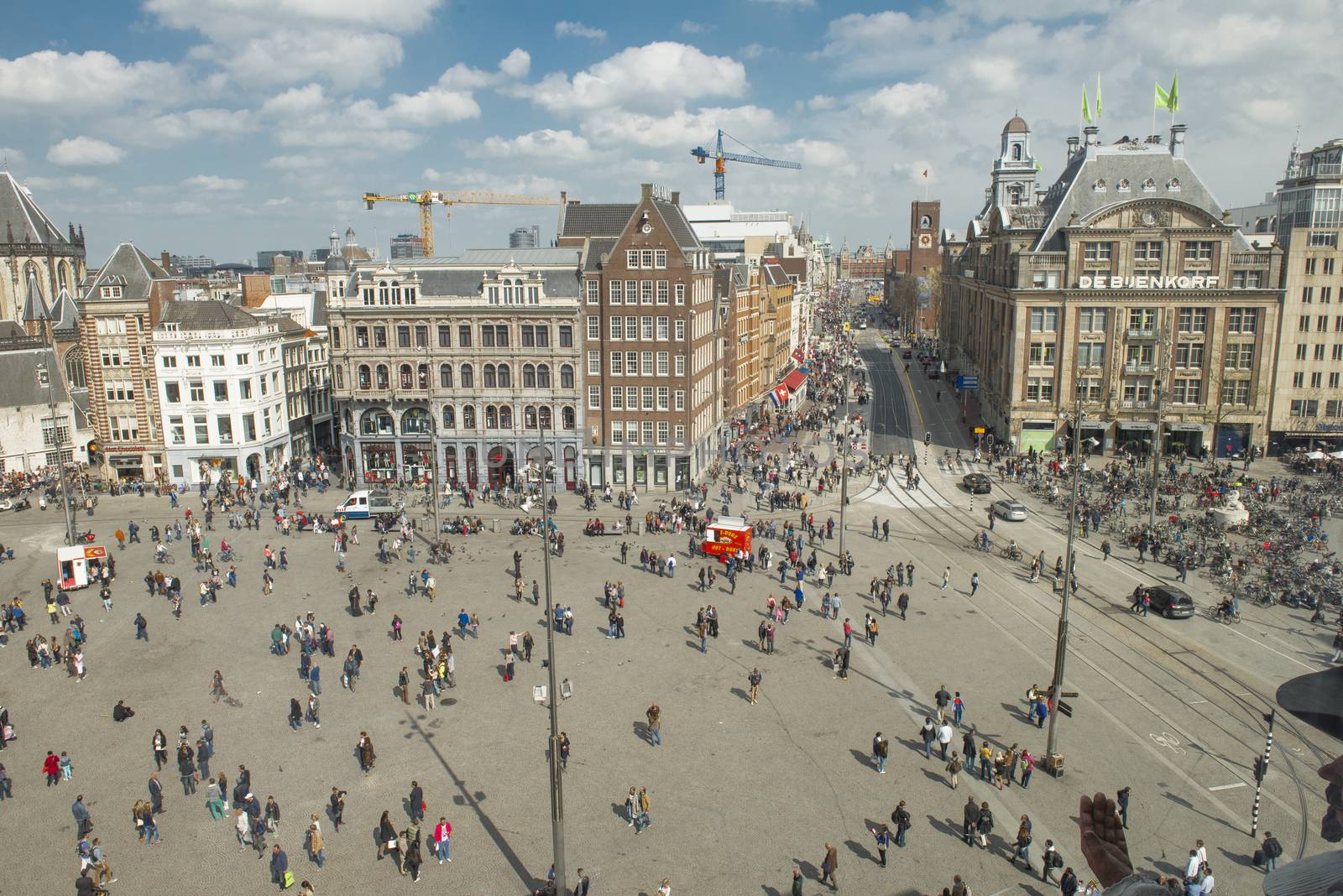 Amsterdam, The Netherlands - April 05, 2014; The Dam square is the very centre and heart of Amsterdam and has seen many historical dramas. The big attractions in Dam Square, Royal Palace.  Although no longer home to the Dutch Royal family, this grand 17th century Royal Palace is still used to hold official receptions.