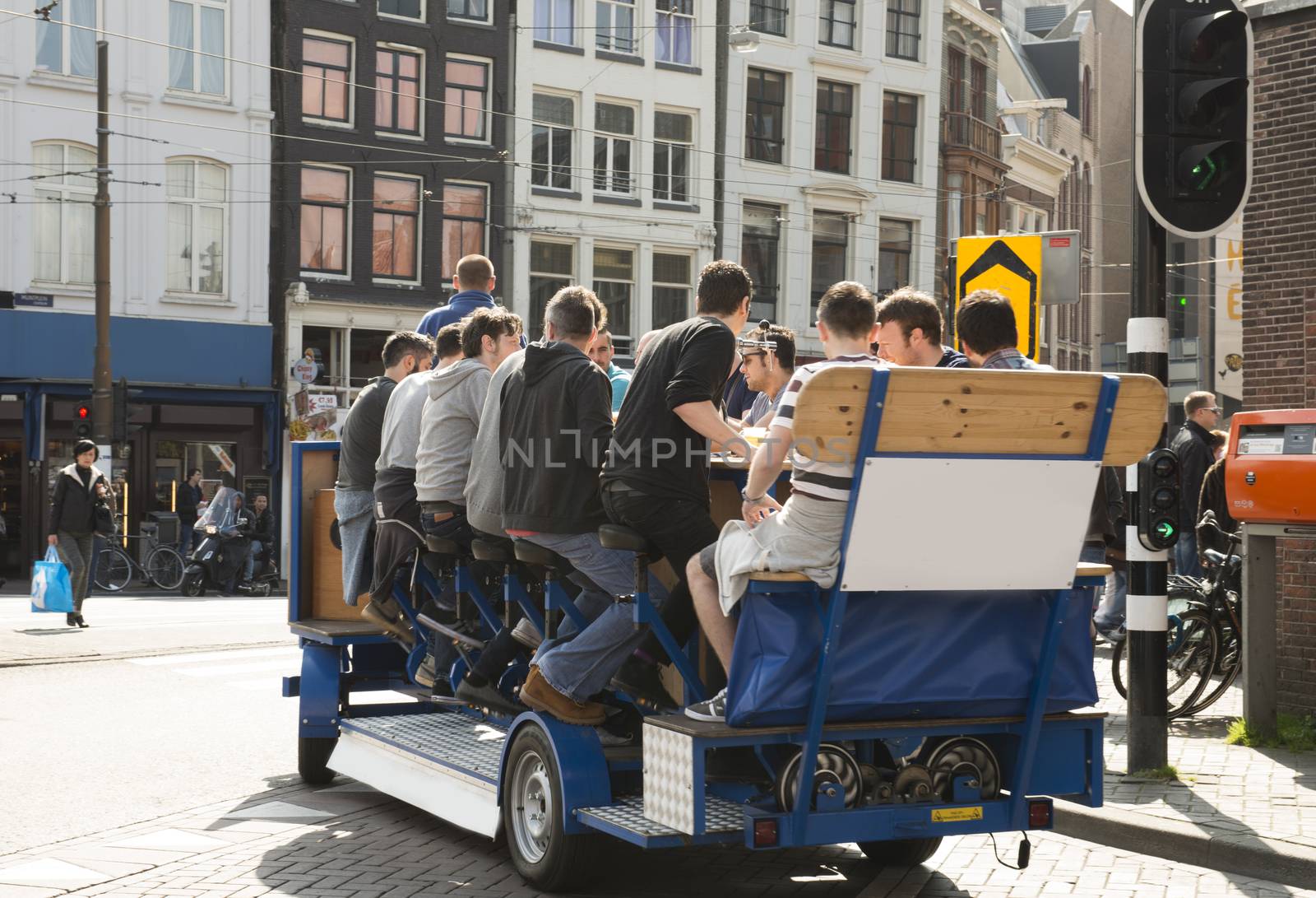 Amsterdam, The Netherlands - April 05, 2014; Brand new attration in Amsterdam. The beer bike in combination with a pub crawl. With this tour tourists can see the hotspots of Amsterdam and the best bars.  