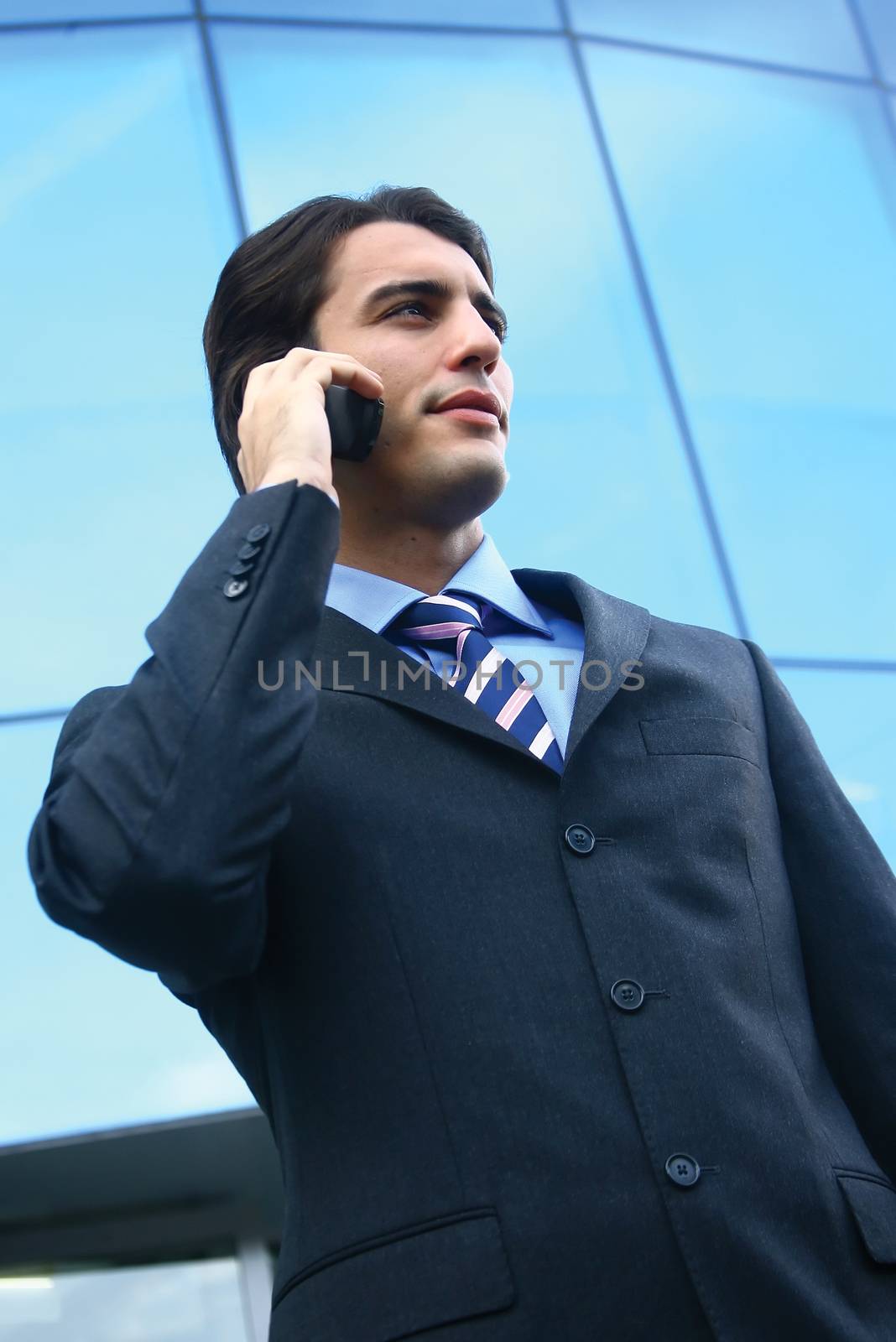a businessman using mobile phone b by toocan