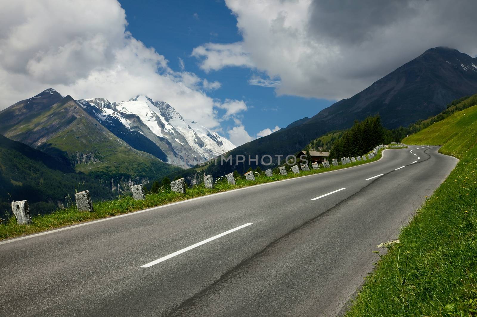 Alpine road between high mountains