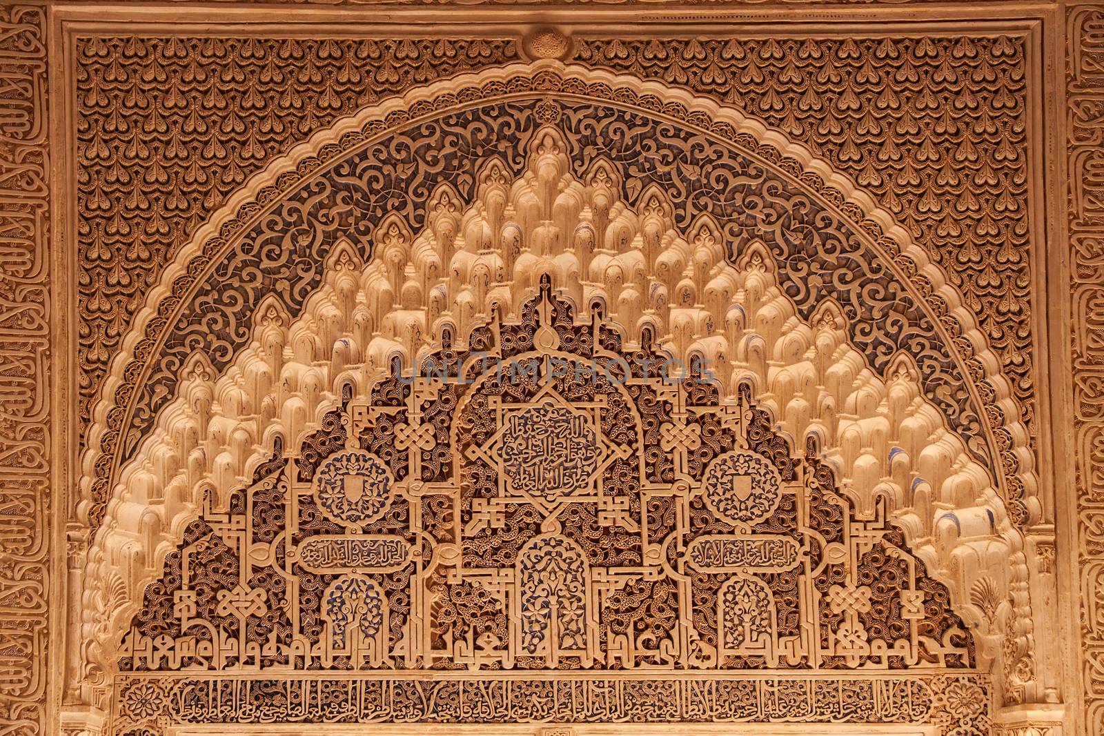 Ancient arabian ornament on a wall in Alhambra palace, Granada, Andalucia, Spain