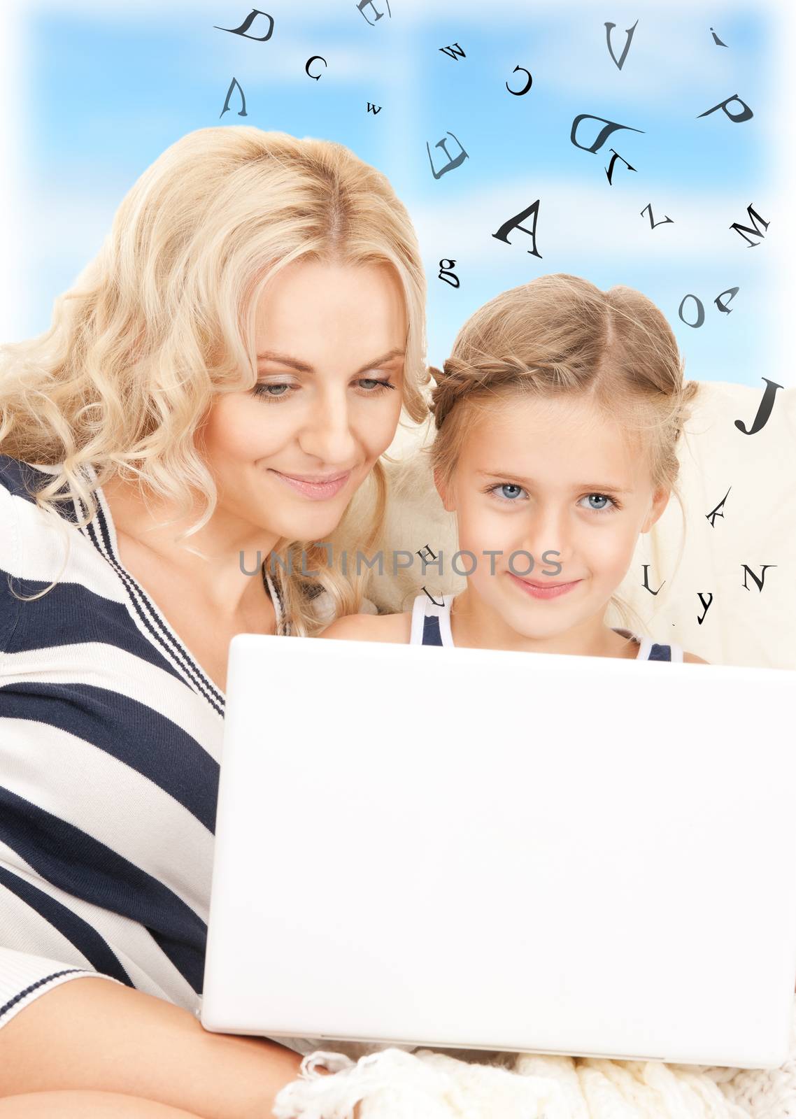 happy mother and child with laptop computer by dolgachov