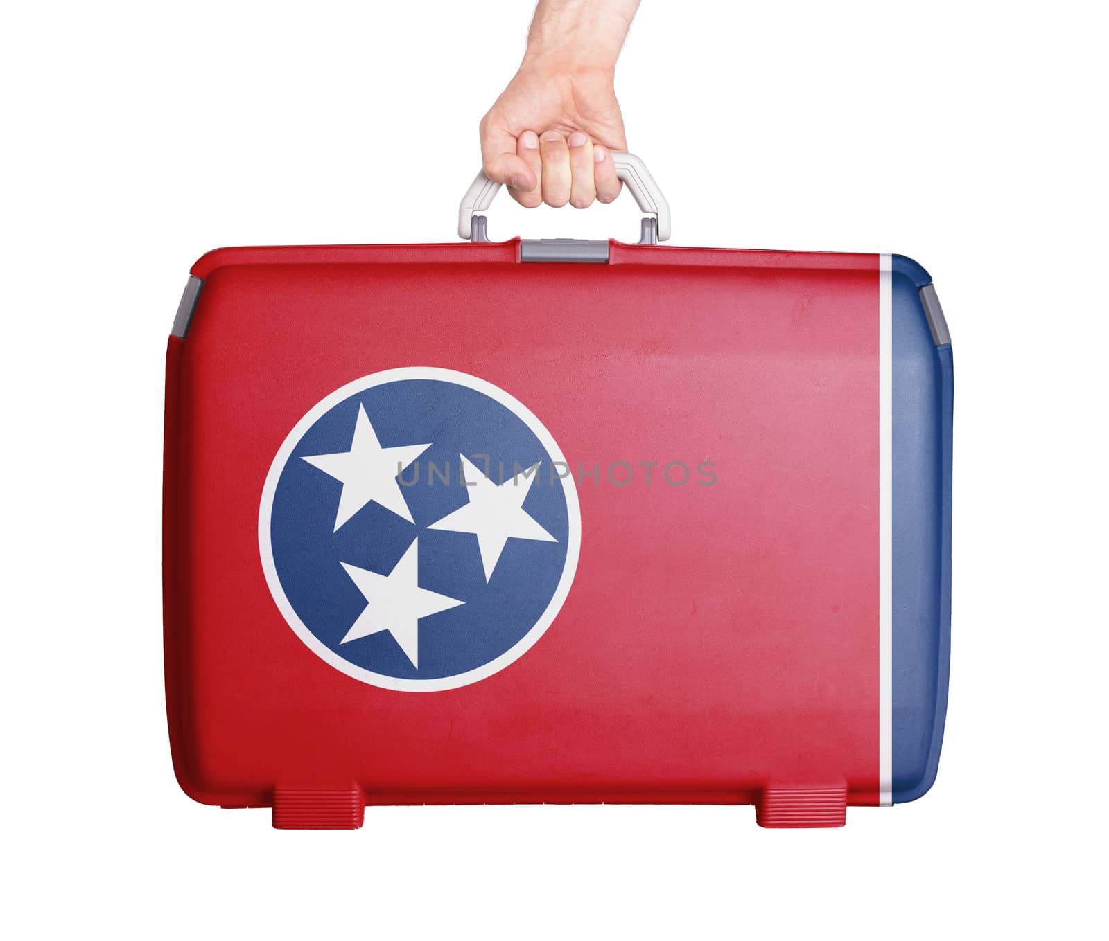Used plastic suitcase with stains and scratches, printed with flag, Tennessee
